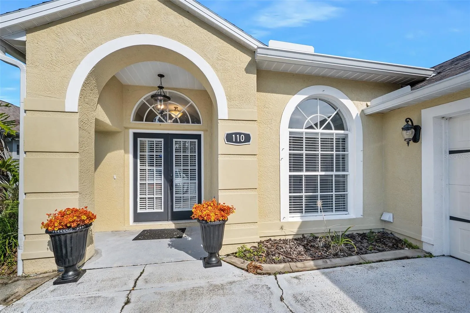 Double entry door with covered area