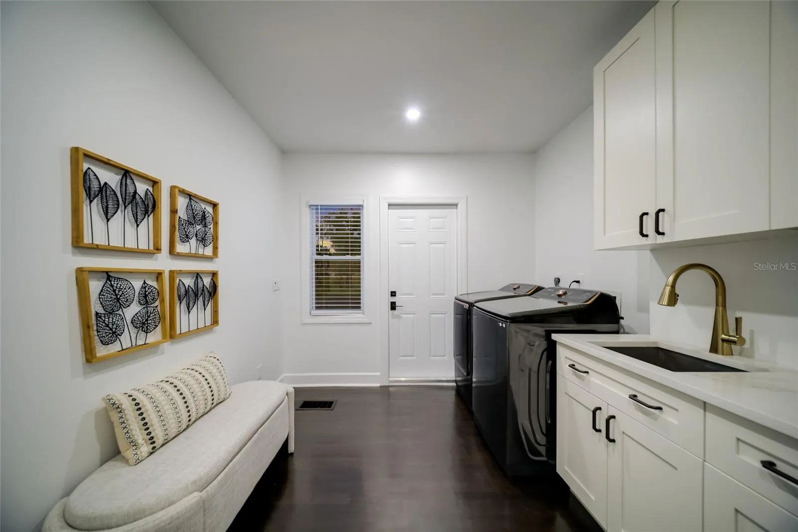 The perfect laundry room with access the the back yard, and garage.