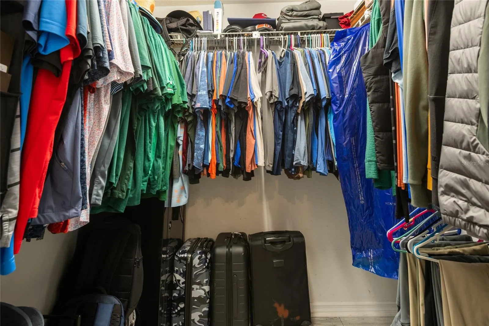 Walk-in closet in primary suite.