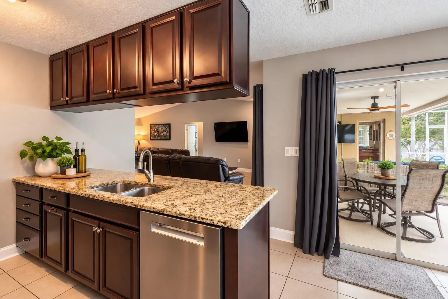 Another view of the kitchen with sliders to the lanai.
