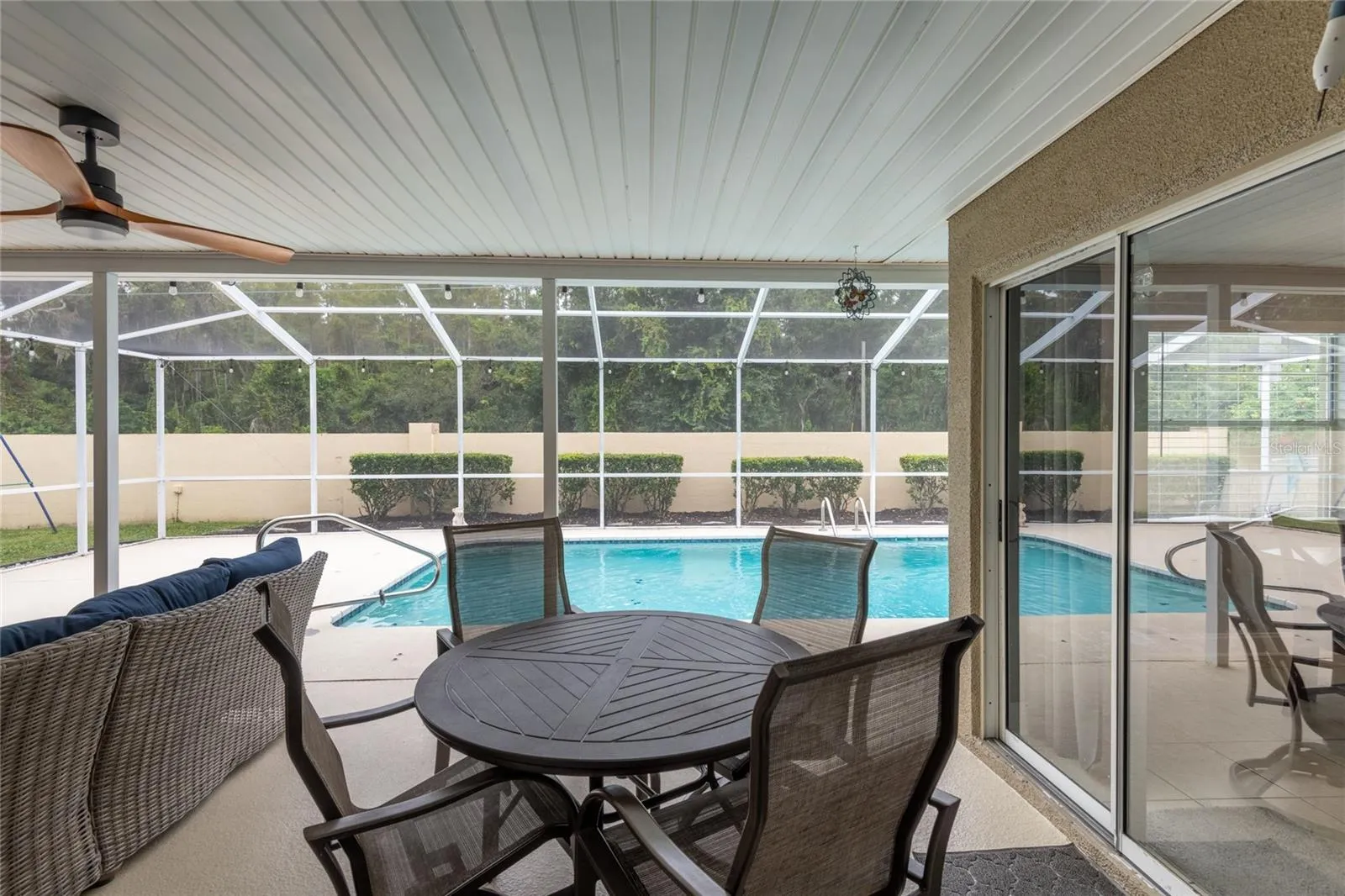 View from great room and the sliders on the right lead to the dinette and kitchen.