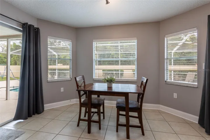 Dinette area with two sliders on each side of this area.