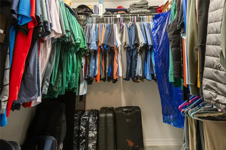 Walk-in closet in primary suite.
