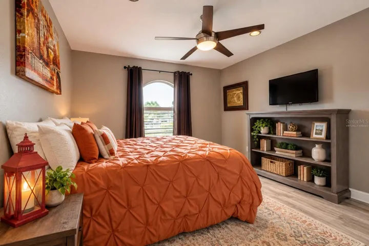 Second bedroom with virtually staged shelves.