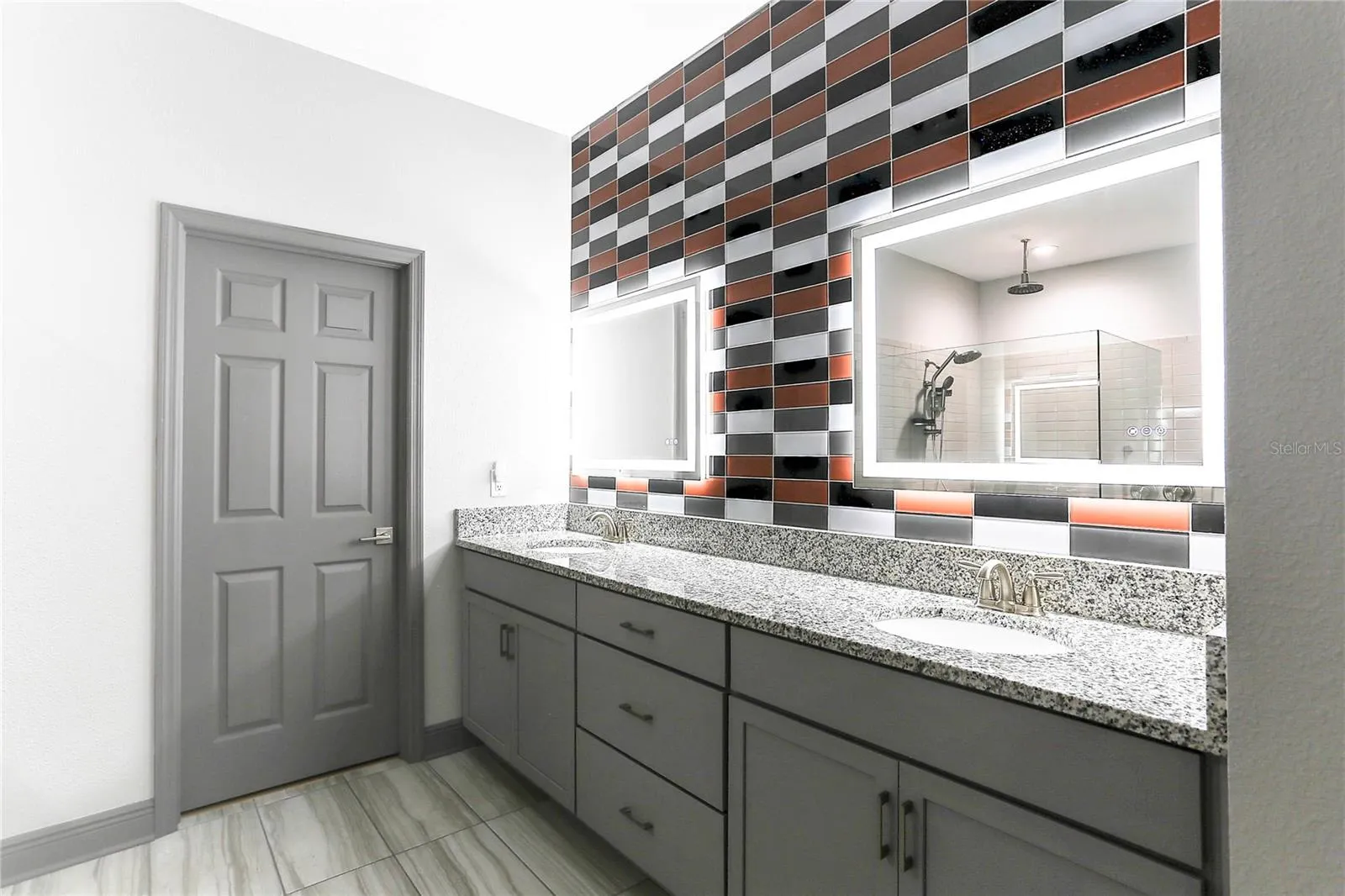 Primary Bath Double Sinks Lighted Mirrors Closet