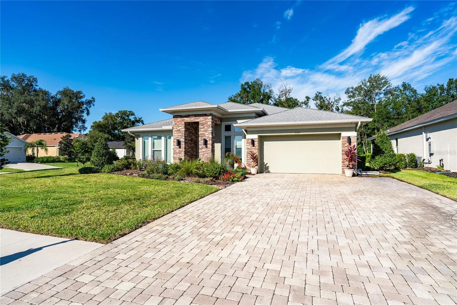 Large, level paver driveway and walkway