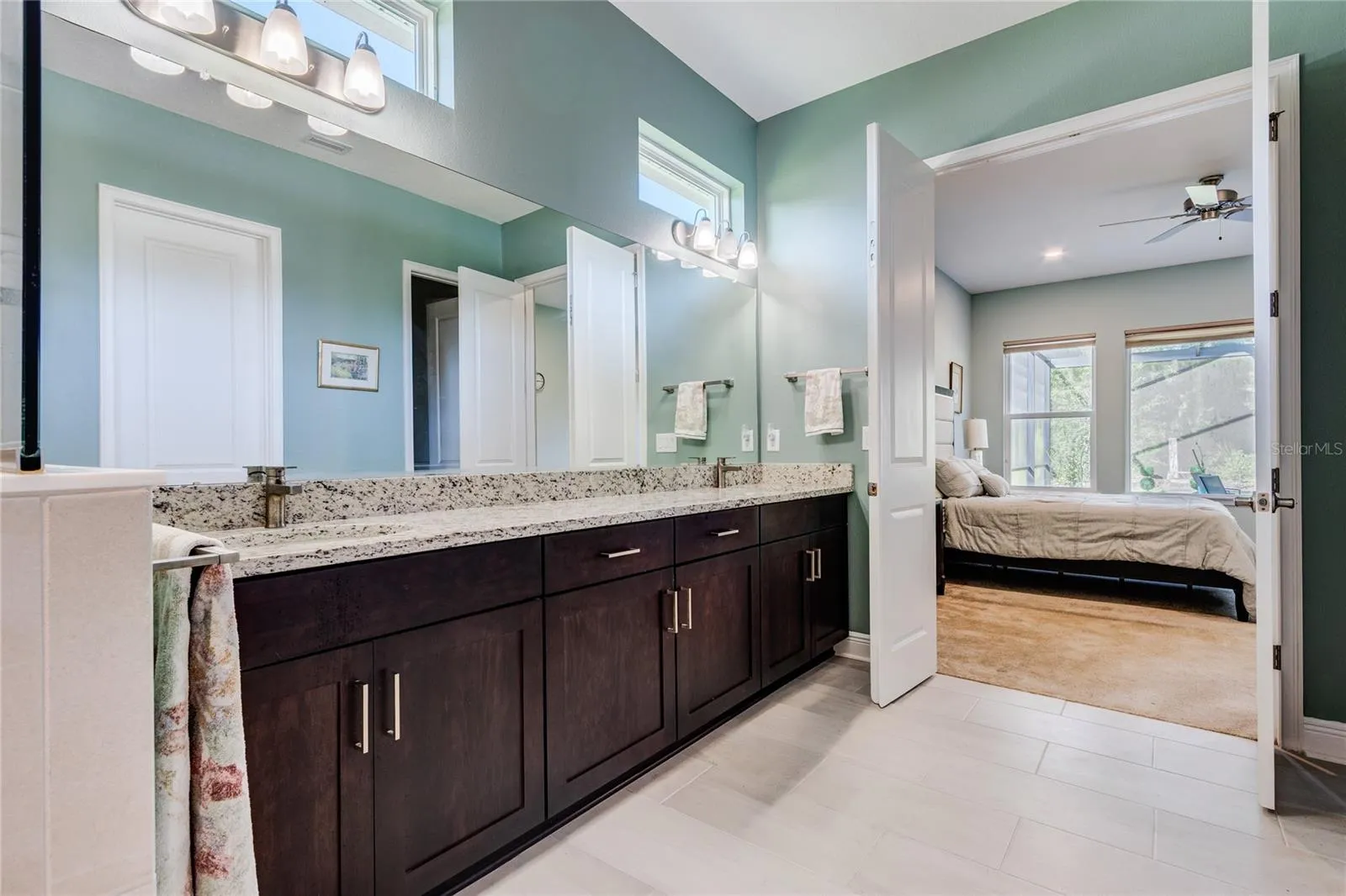 Luxurious bath ensuite with dual sinks , tub and large shower