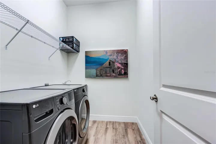 Interior Laundry room with storage above!