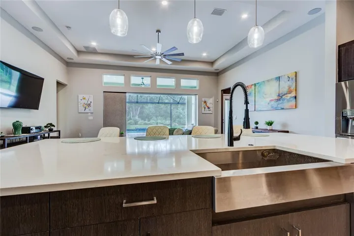 Farmhouse stainless sink in quartz center island