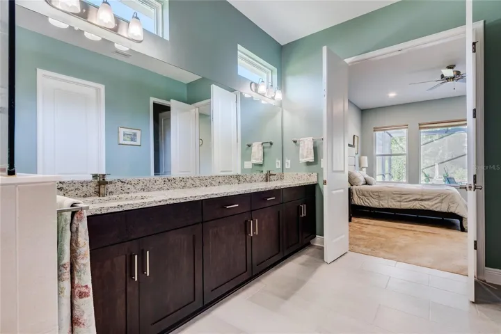 Luxurious bath ensuite with dual sinks , tub and large shower