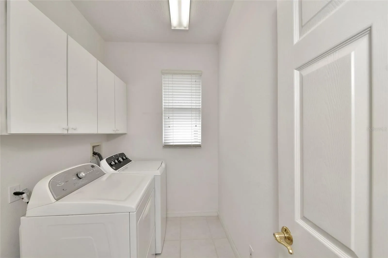 Inside laundry, natural gas dryer, not shown utility sink.