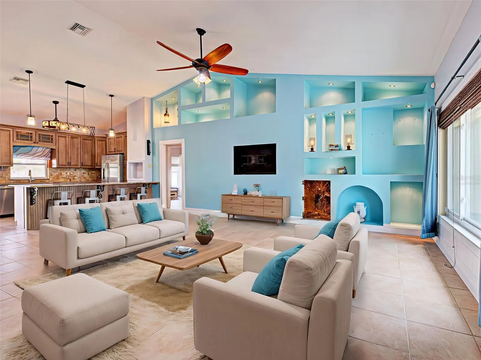 Virtually staged. The Great Room wall grabs yhour attention with nooks and crannies to show off your art work.