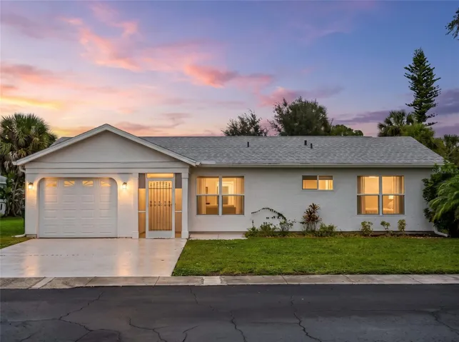 FrontExterior_8130PickwickRd_NorthPort_CurbAppeal_Twilight.jpg