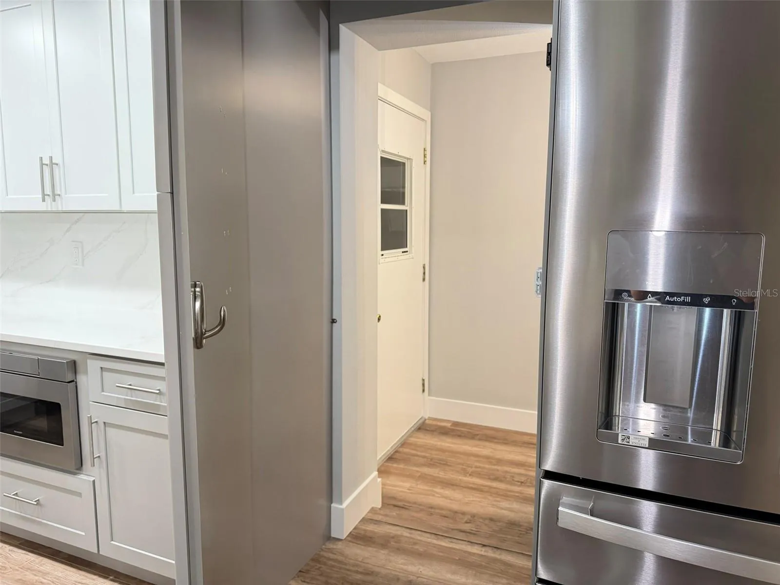 Cabinet Entry to Laundry Room/Garage