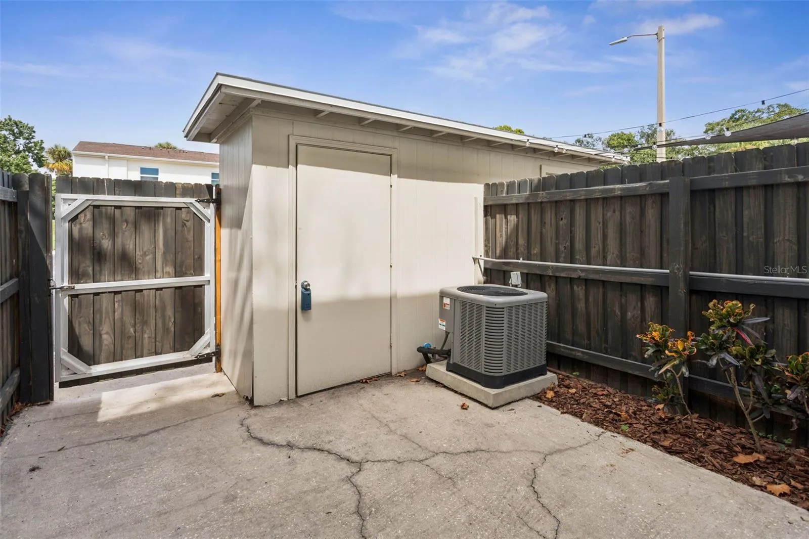 back patio reverse angle showing shed