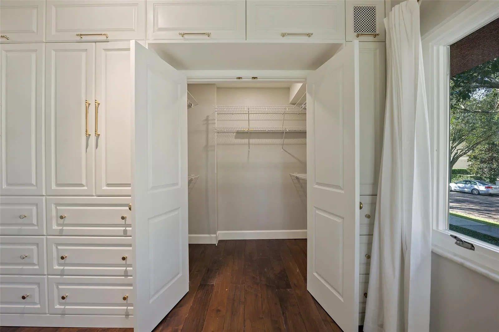 Primary bedroom walk-in closet