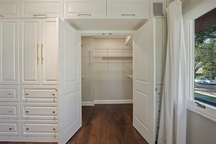 Primary bedroom walk-in closet