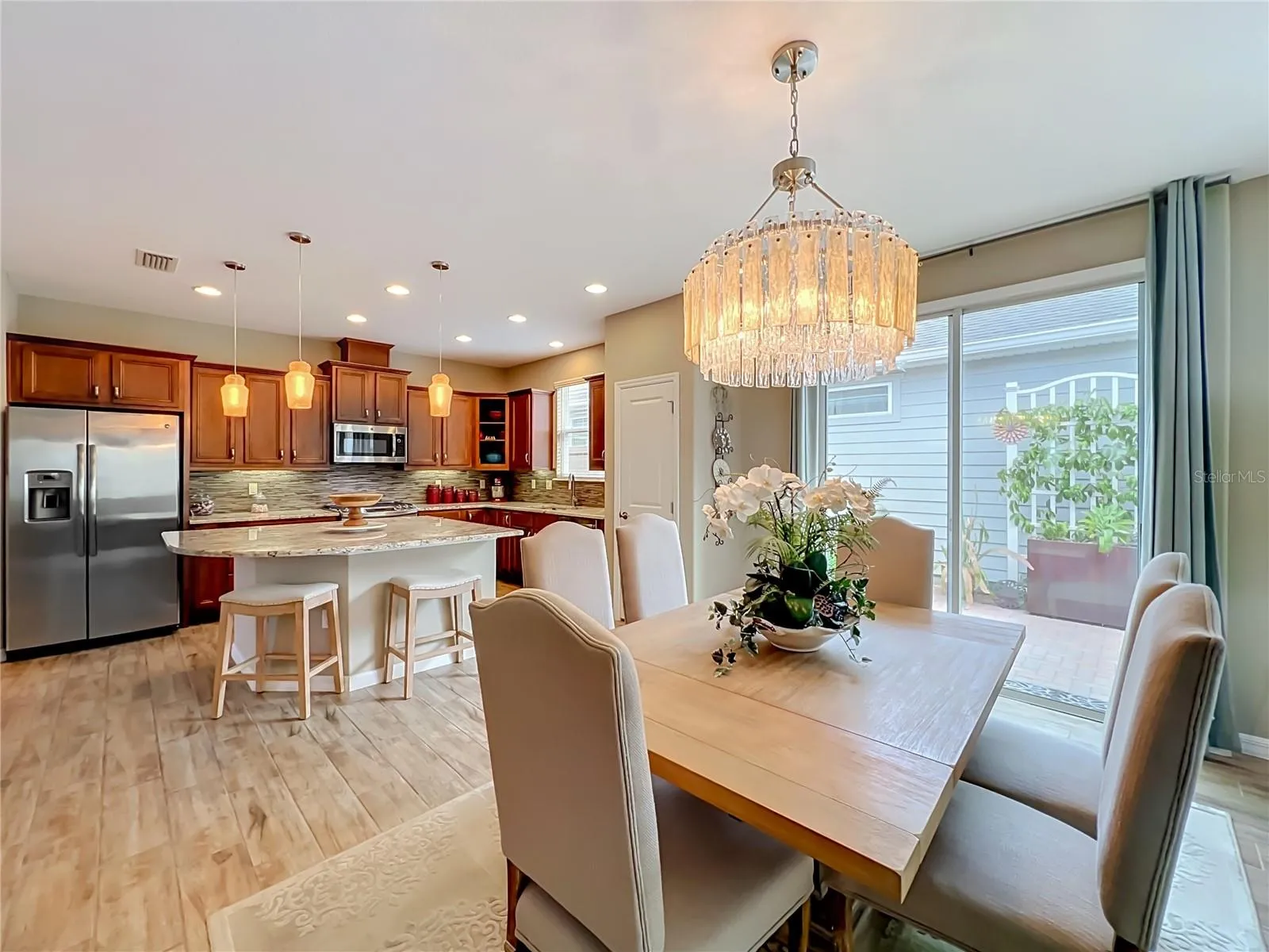 Dining area with sliders to side patio