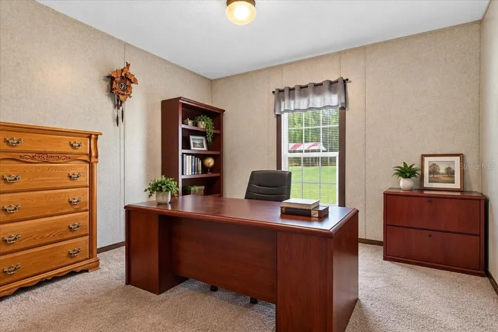 A second bedroom currently used as an office space -