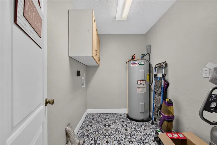Spacious laundry and utility room in the main home
