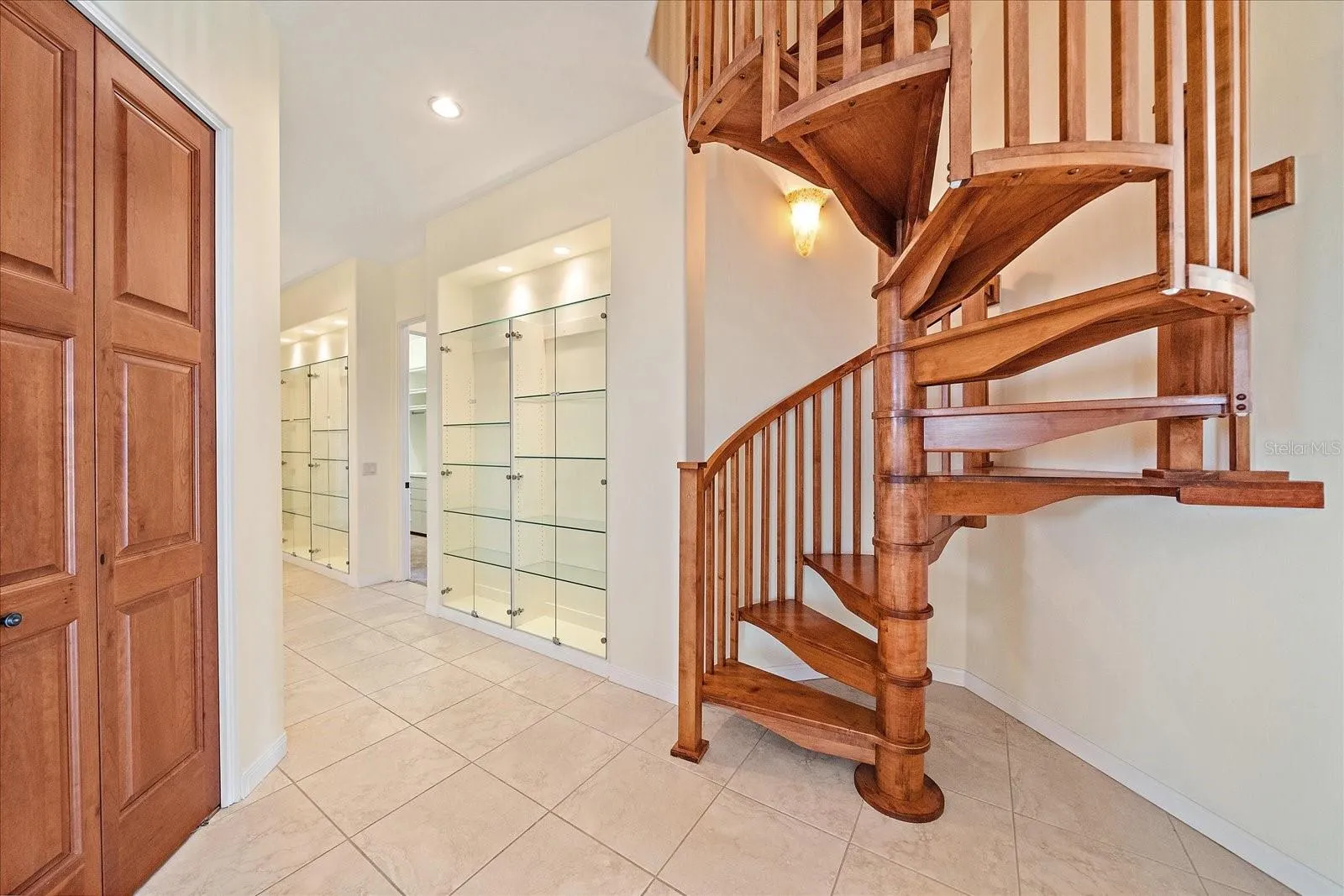 Custom wood spiral staircase to the third floor