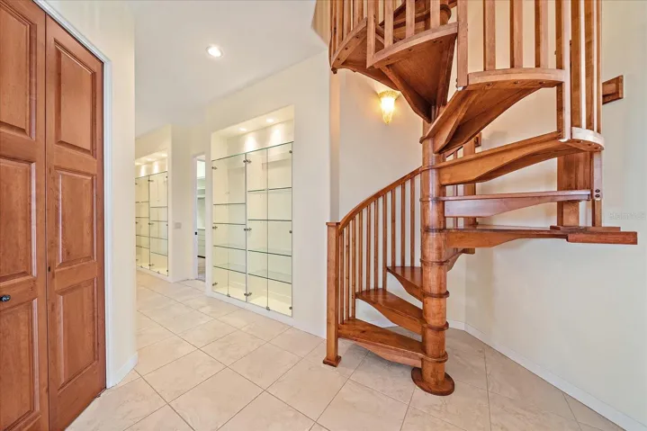 Custom wood spiral staircase to the third floor