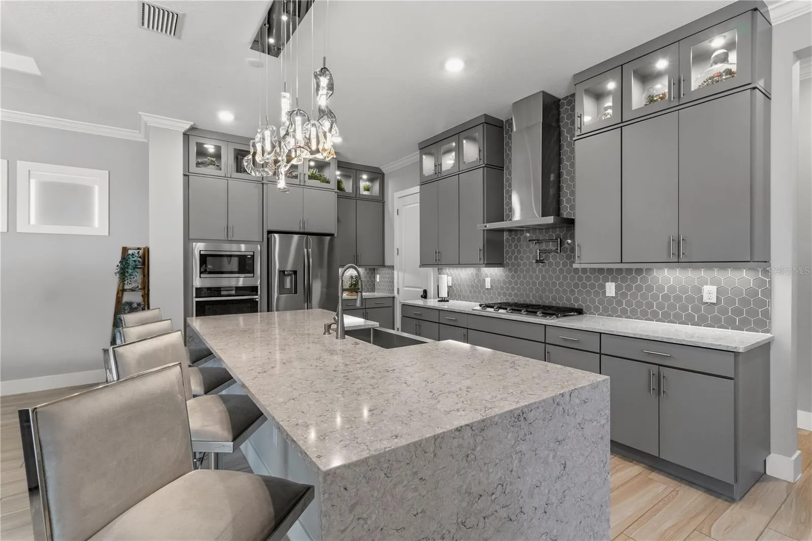 Gorgeous chef kitchen with updated lighting