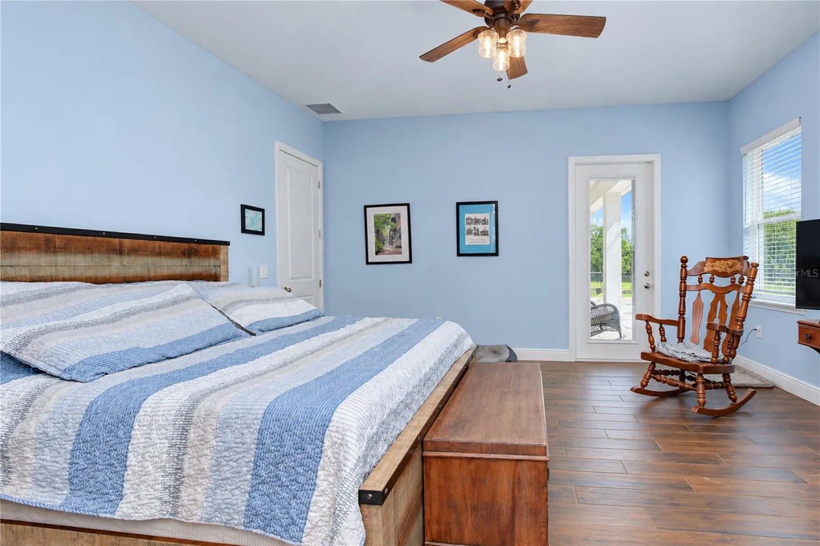 Primary Bedroom with door leading to pool