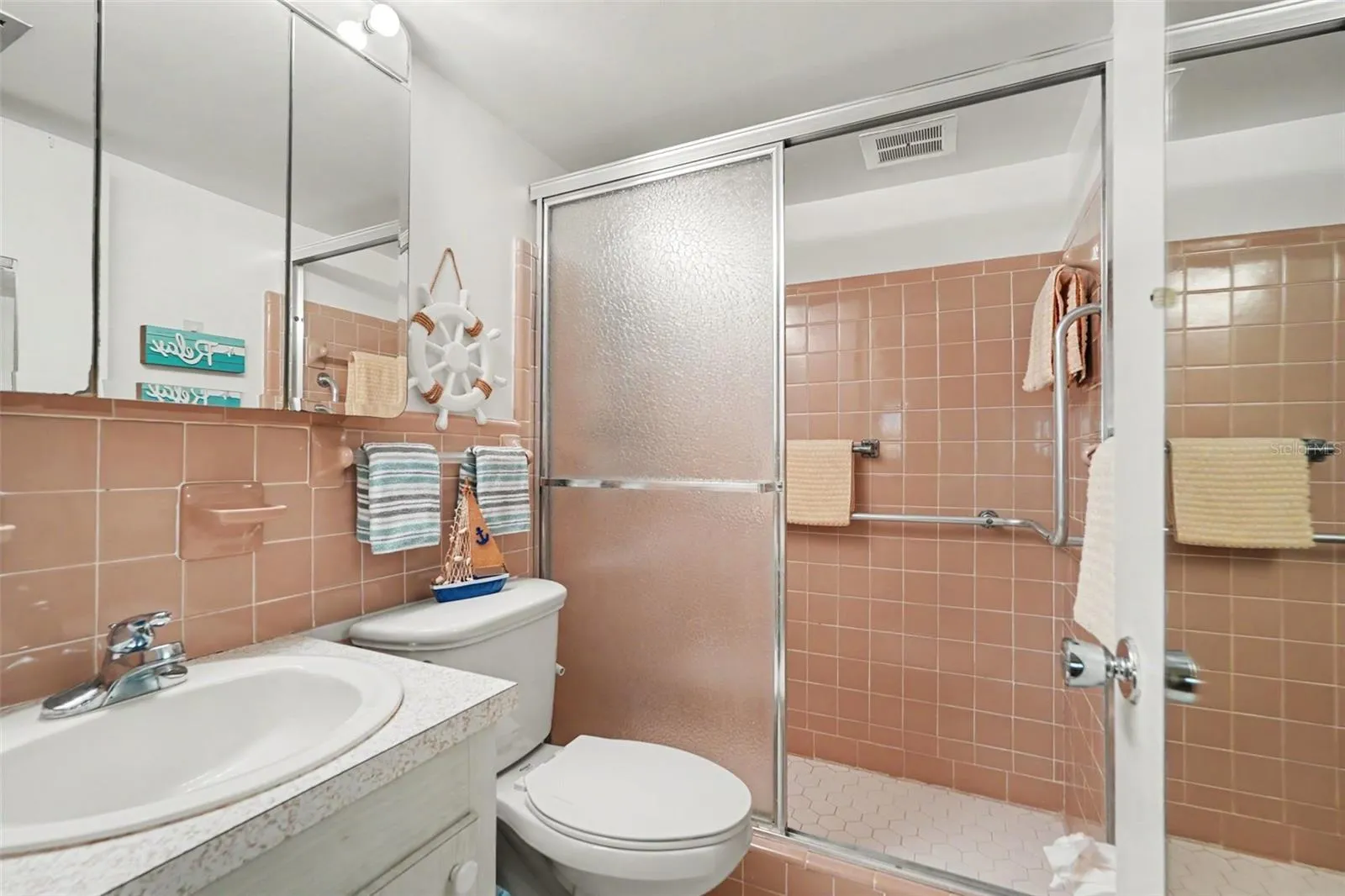 Private en-suite primary bathroom with full size shower