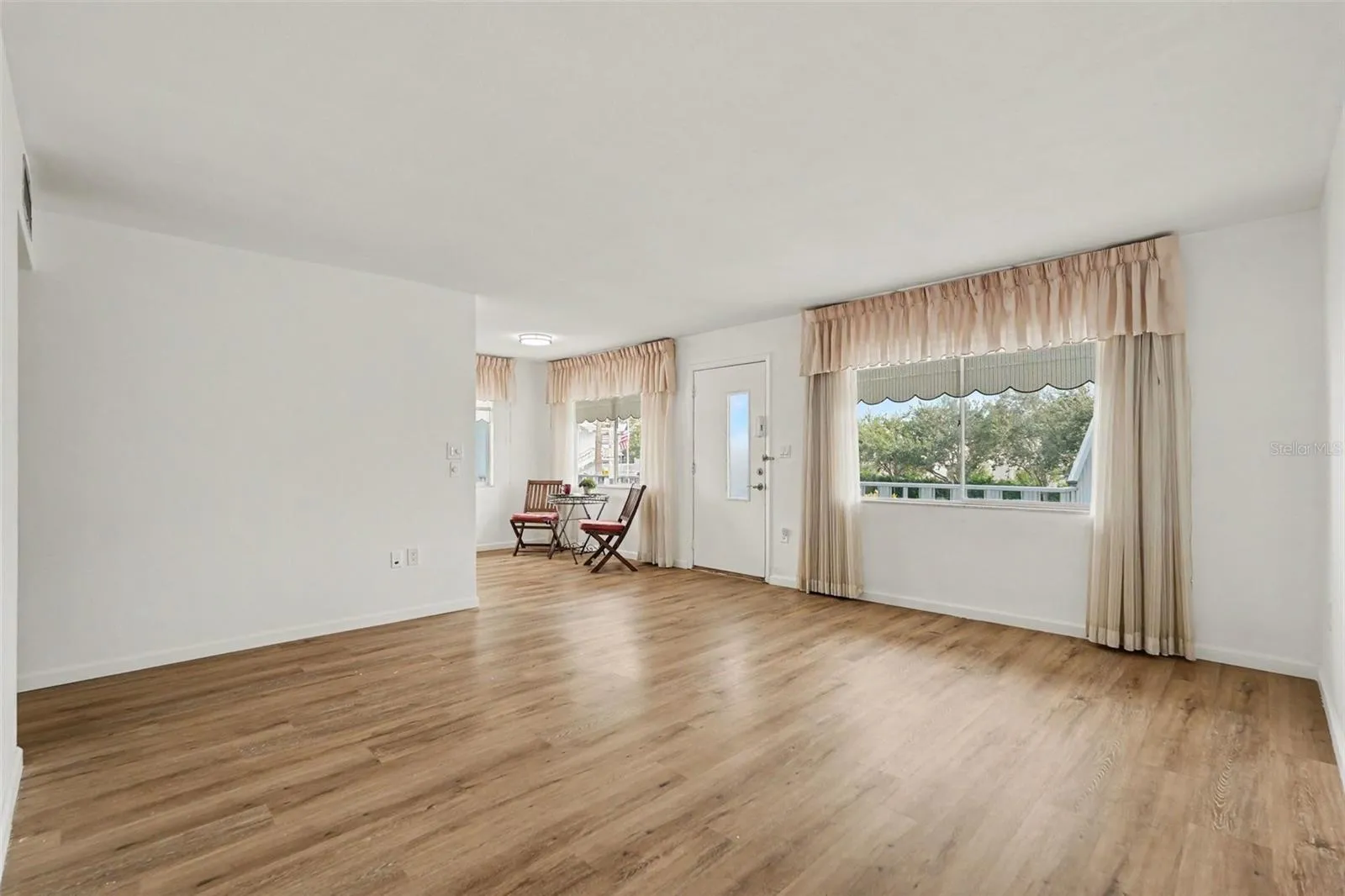 New flooring greets you in this large sun filled corner unit condo!