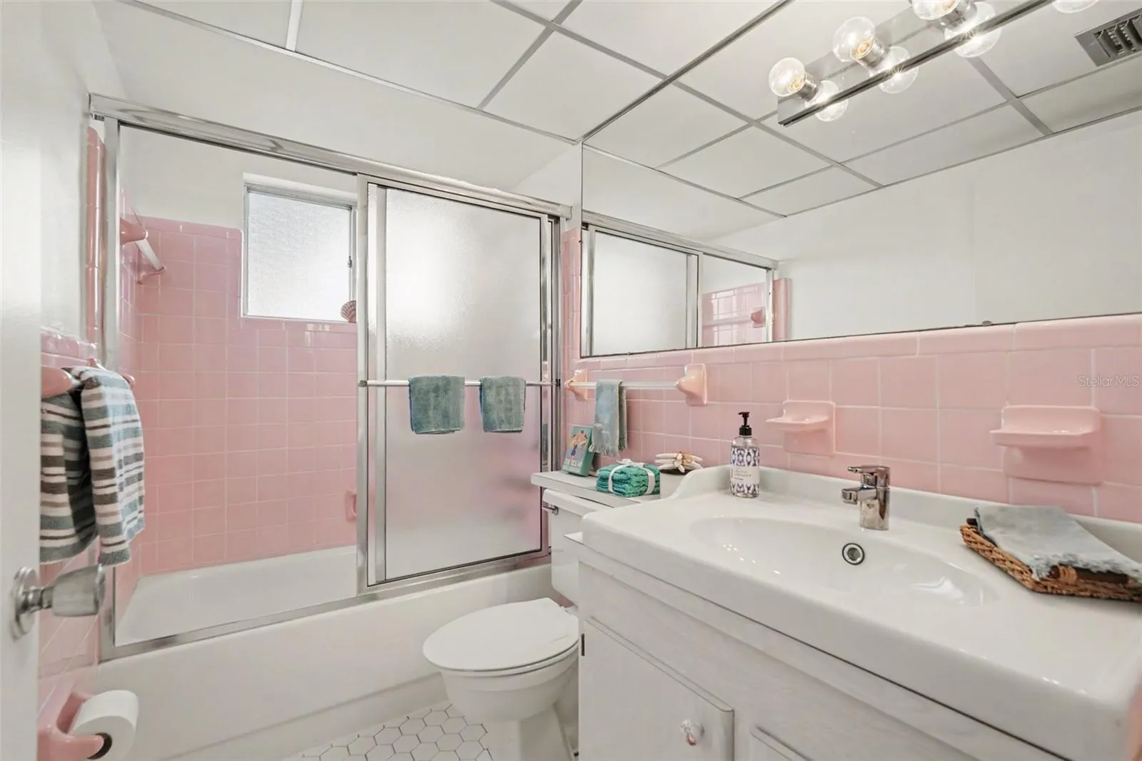 Hall bath has full size tub/shower and an updated vanity too!