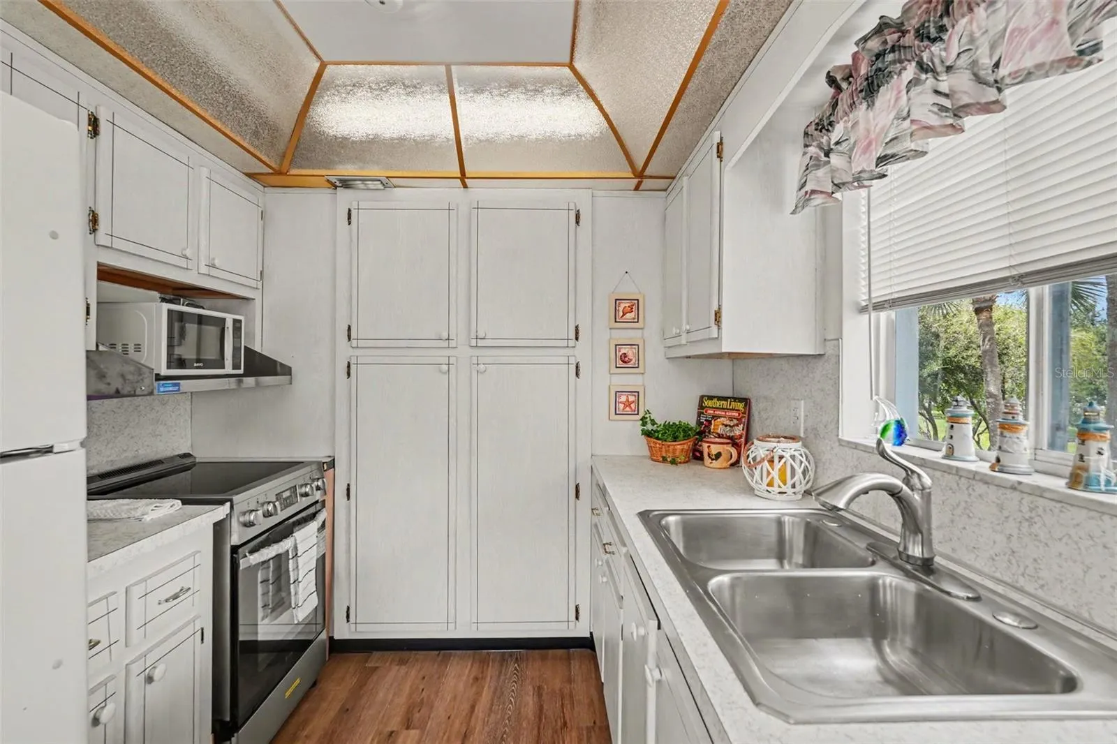 Galley style kitchen has lots of storage!