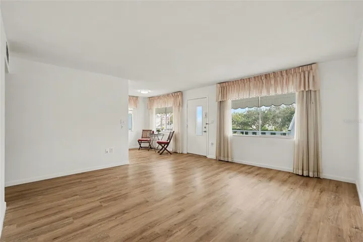 New flooring greets you in this large sun filled corner unit condo!