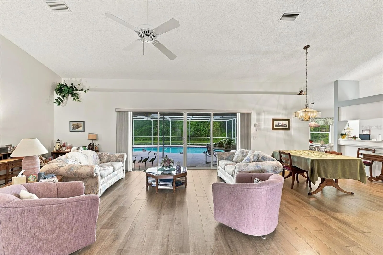 Living room area with access to pool