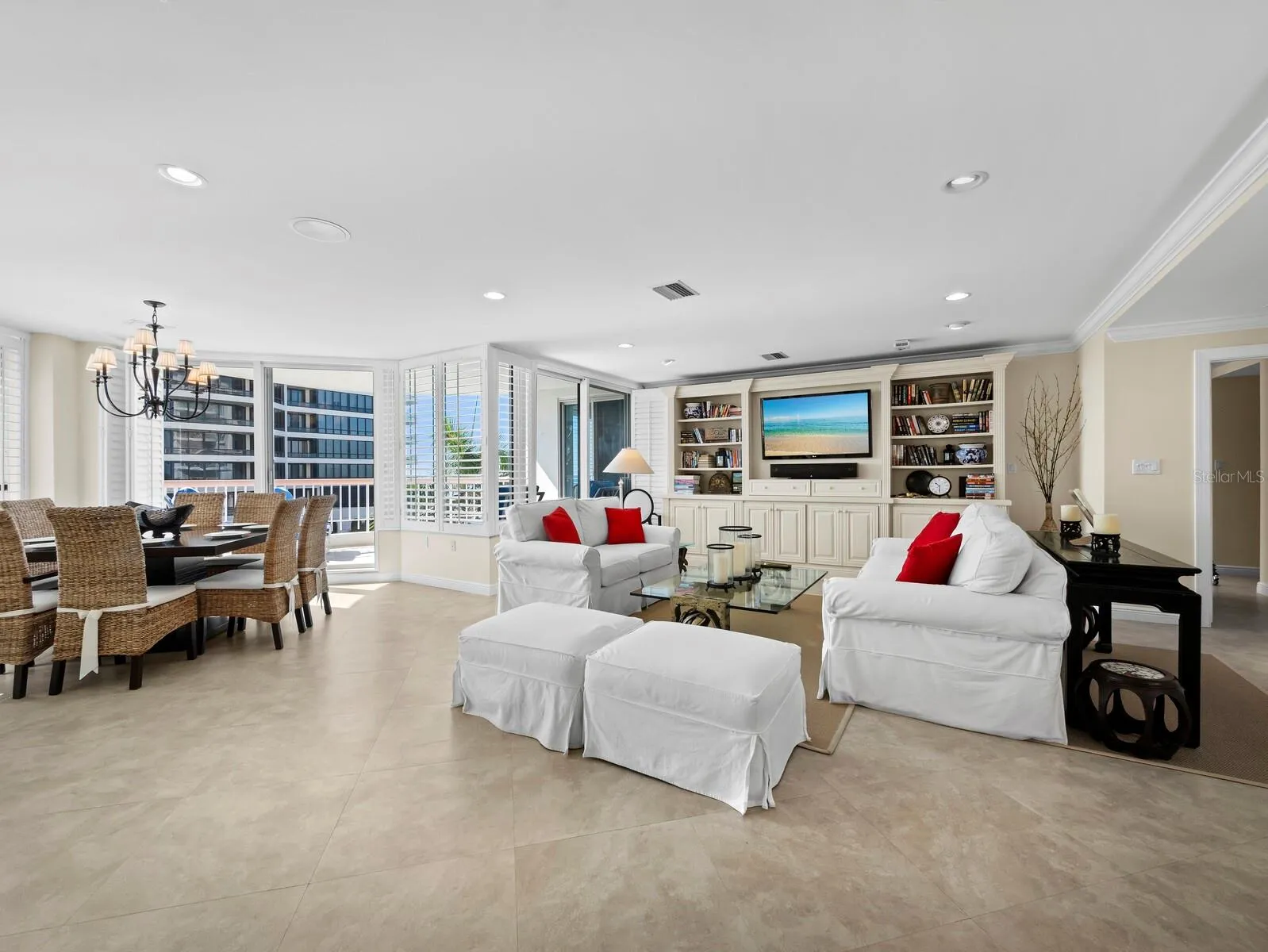 Designed for gracious entertaining and easy living, the living/dining area offers dual aspect views and direct access to both balconies. Built-ins and millwork elevate coastal living with simple elegance.
