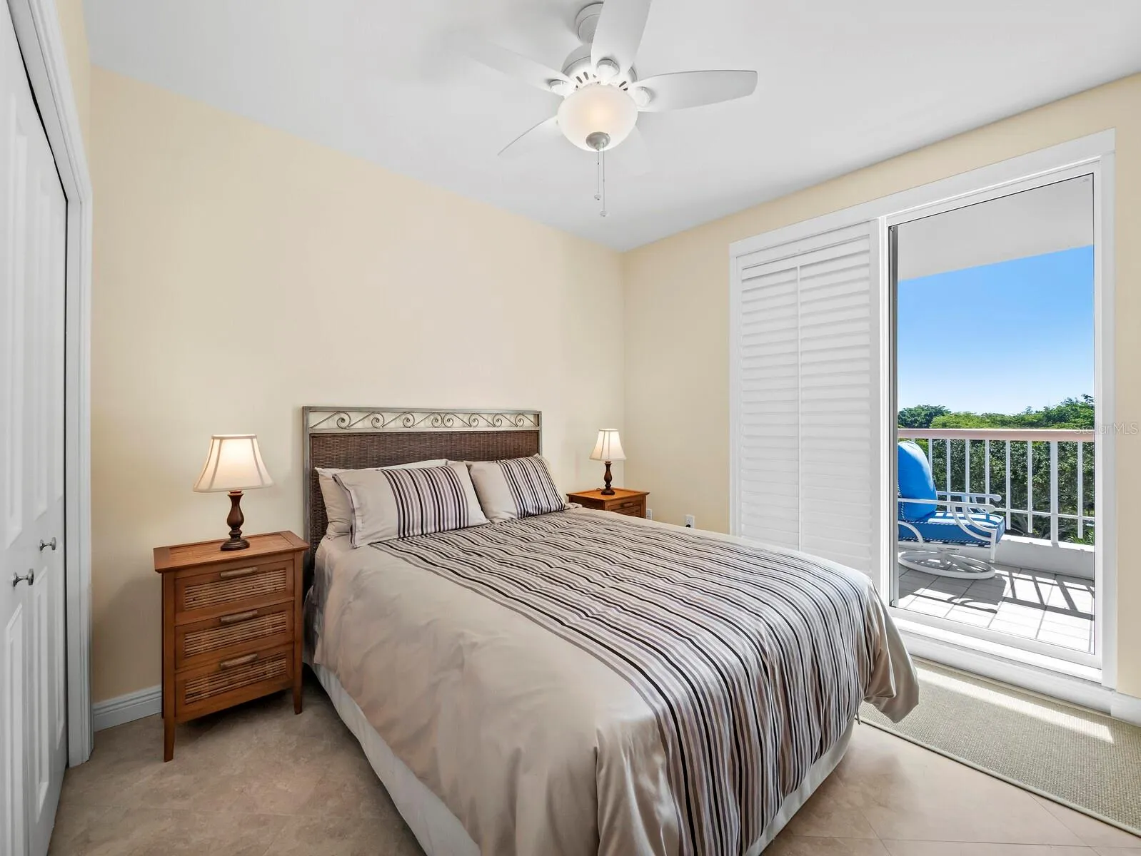 Comfortable Guest bedroom opposite the Primary with large closet, private access to large balcony.