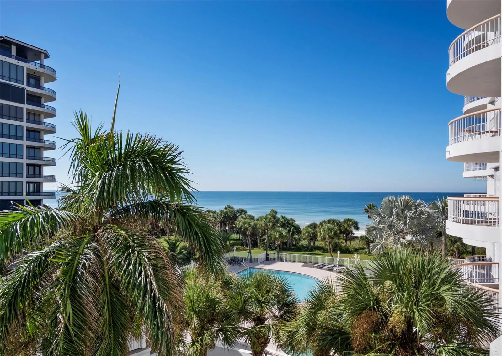 Your direct gulf view overlooks pool & spa area, with the deeded beach beyond.
