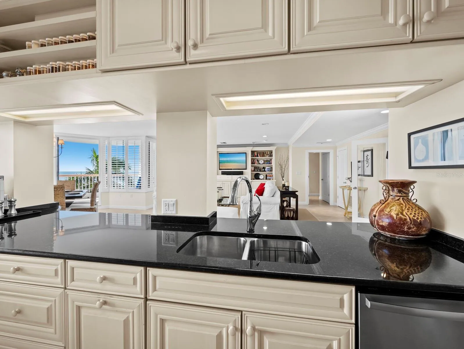 Kitchen with views to the living area and the Gulf beyond