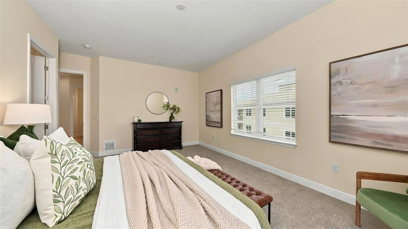 Primary bedroom suite with private balcony