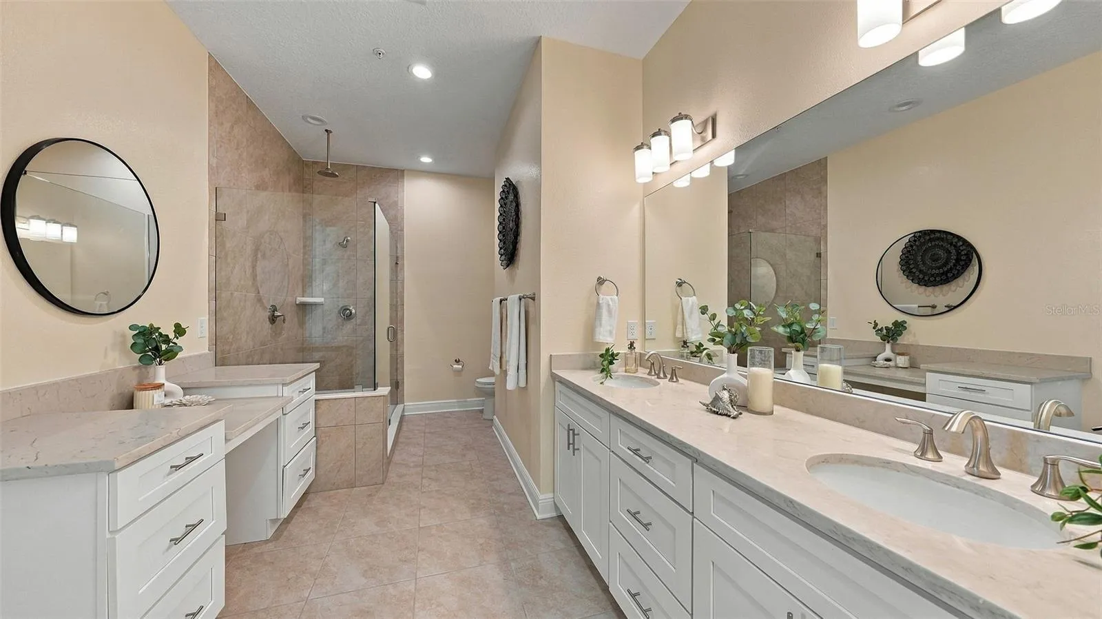 Upgraded primary bathroom with large shower and vanity