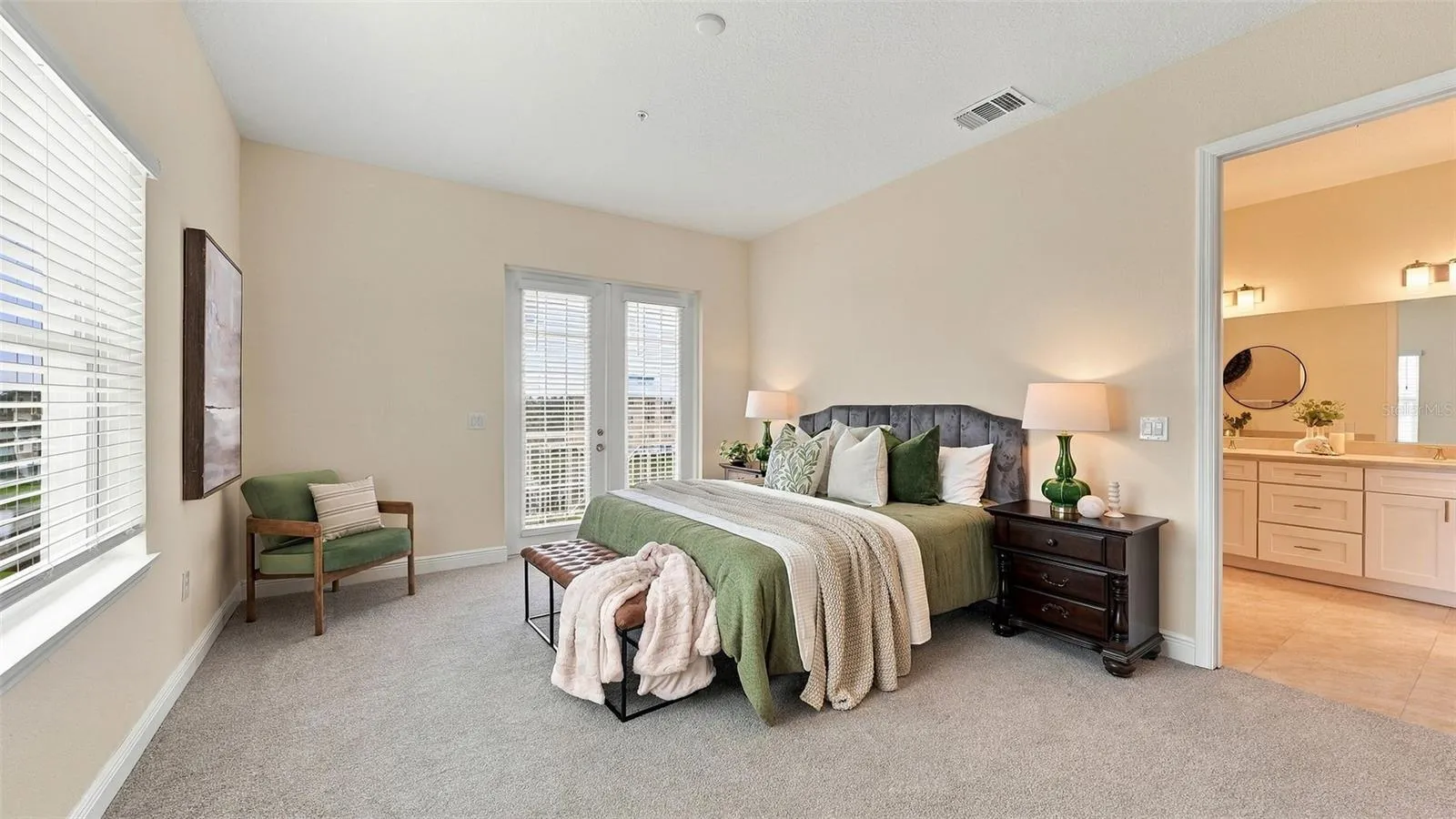 Primary bedroom suite with private balcony