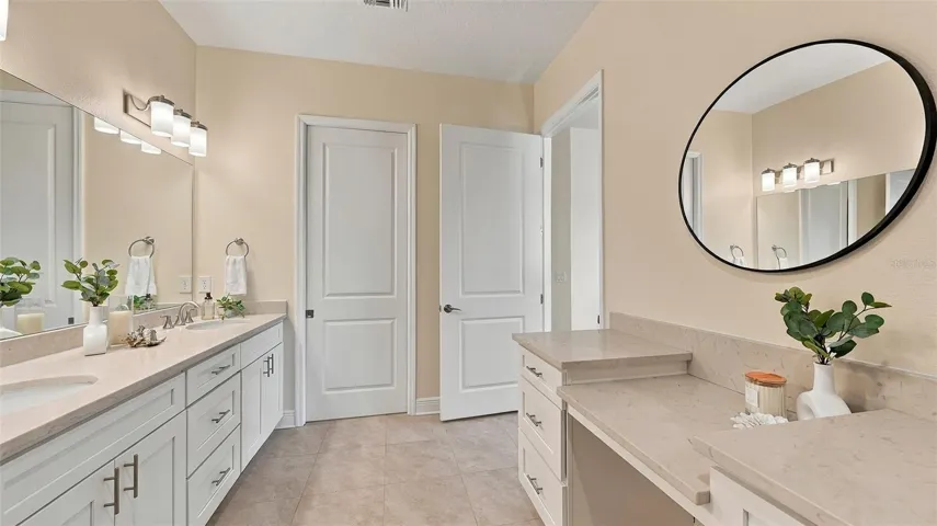 Upgraded primary bathroom with large shower and vanity