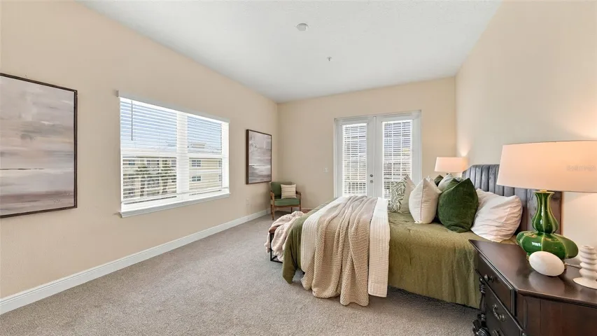 Primary bedroom suite with private balcony