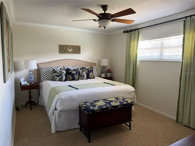 Bedroom 4 with ensuite and access to screened porch and pool