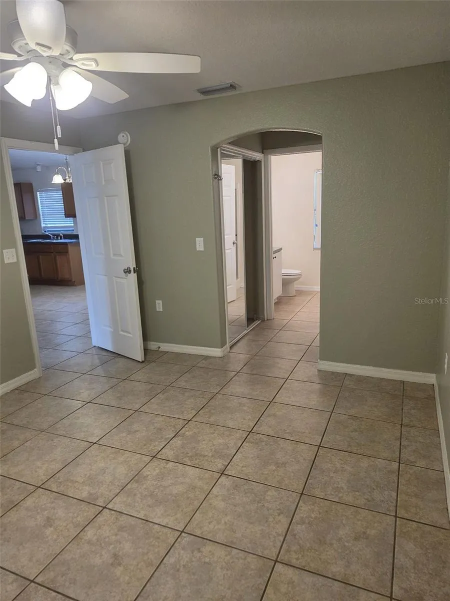 Primary bedroom with closet and private bath