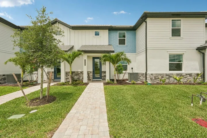 Front Exterior-Photo description represents the model home of same floor plan.
