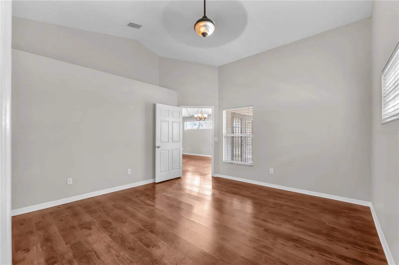 A view from the primary bedroom into the great room.
