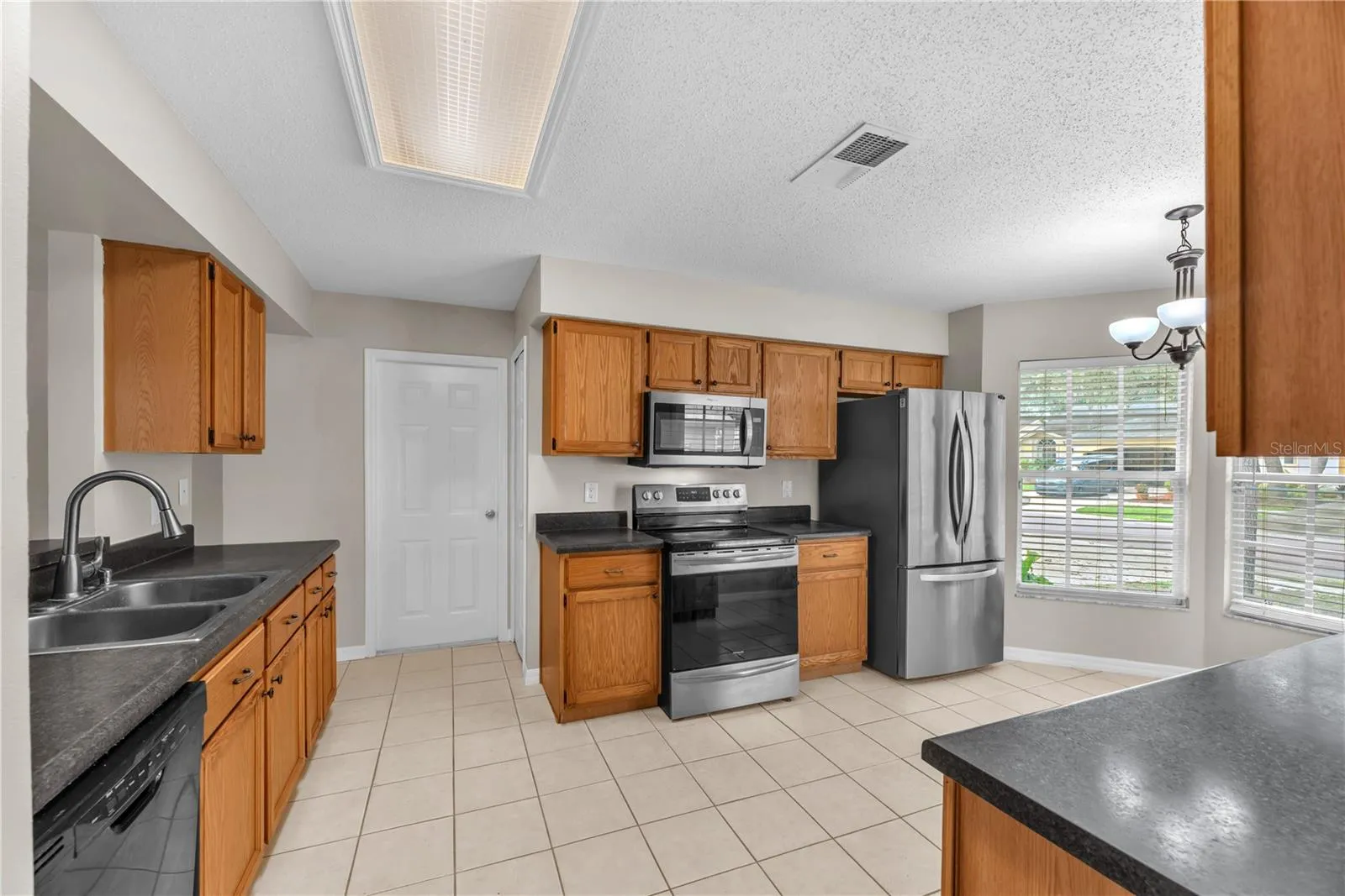 Spacious kitchen with bump out for an eat-in the kitchen area. Stainless steel appliances are a plus.