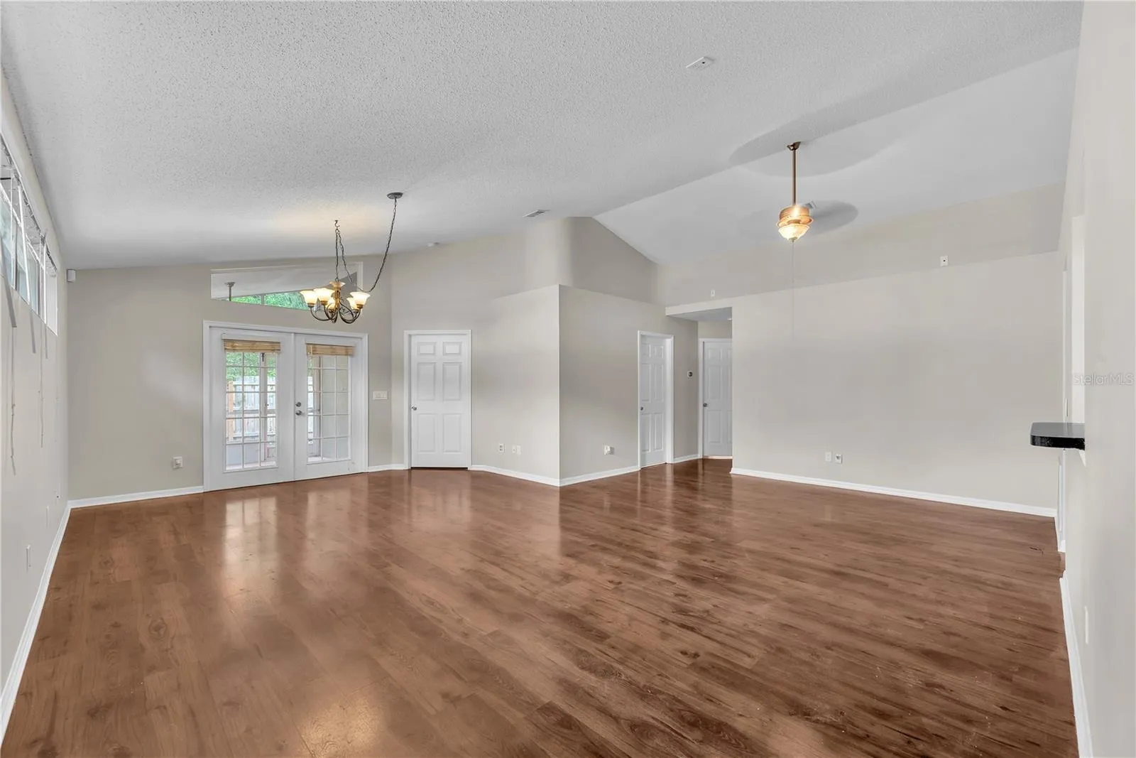Notice the pass thru window and there's also a walk thru opening into the dining area in the great room plan. French doors lead to the back yard.