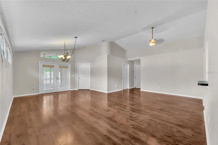 Notice the pass thru window and there's also a walk thru opening into the dining area in the great room plan. French doors lead to the back yard.